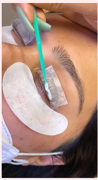 A keratin lash lift in progress with lash shields in place