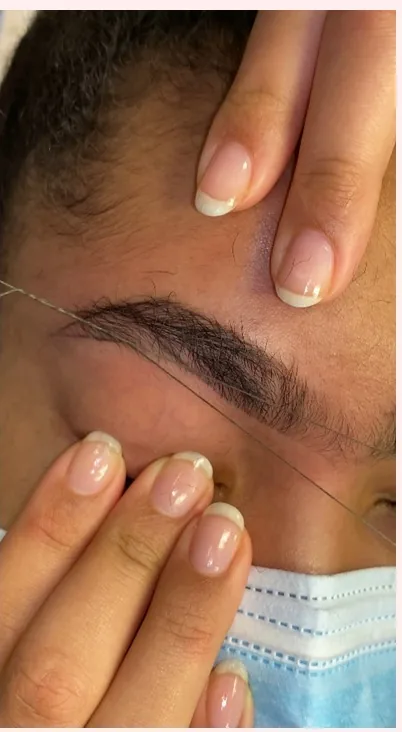 Brow mapping with thread during a Royale Brows appointment